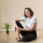 Johanna Schottman of StudioCor sitting on the ground